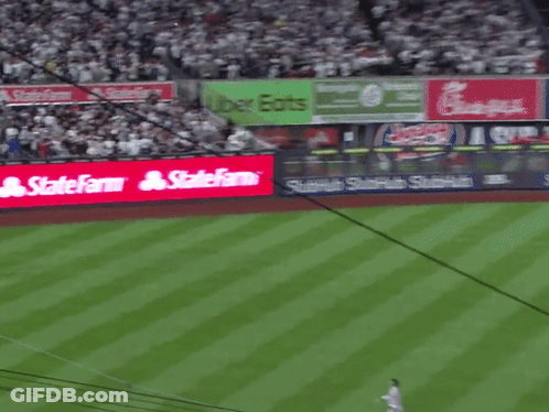 A Baseball Field With A Sign That Says Statefarm On It GIF