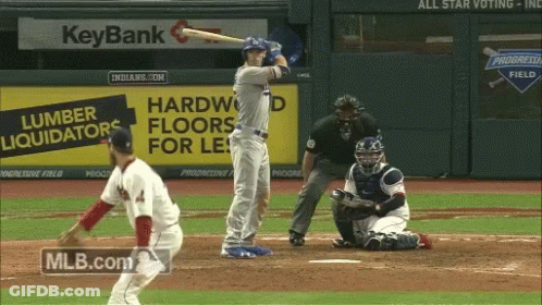 A Baseball Game Being Played In Front Of A Keybank Sign GIF