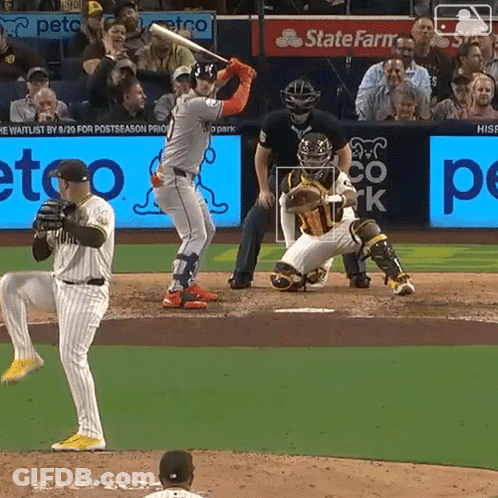A Baseball Game Being Played In Front Of A State Farm Ad GIF