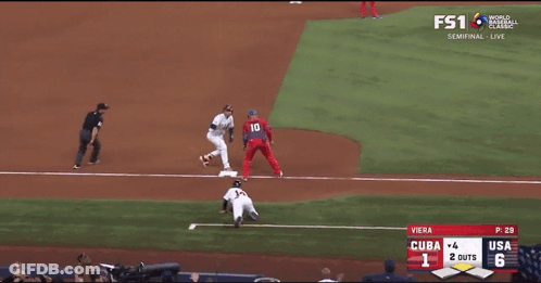 A Baseball Game Between Cuba And The Usa Is Being Played GIF