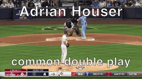 A Baseball Game Is Being Played And Adrian Houser Is Pitching The Ball GIF