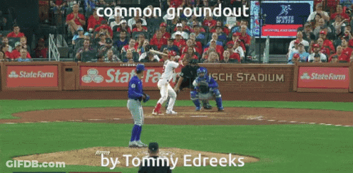 A Baseball Game Is Being Played At Busch Stadium And The Player At Bat Is Named Tommy Edreeks GIF