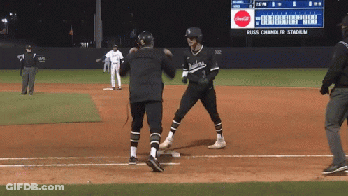 A Baseball Game Is Being Played At Russ Chandler Stadium With A Coca Cola Ad On The Scoreboard GIF