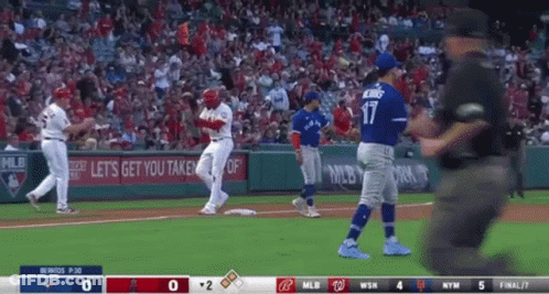 A Baseball Game Is Being Played Between The Angels And The Blue Jays GIF