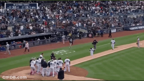 A Baseball Game Is Being Played In A Stadium With A Banner That Says Gleyber Torres GIF