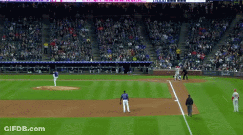 A Baseball Game Is Being Played In A Stadium With A Sign That Says ' Coca Cola ' On It GIF