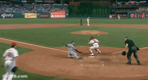 A Baseball Game Is Being Played In A Stadium With A State Farm Ad GIF