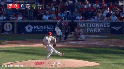A Baseball Game Is Being Played In A Stadium With Advertisements For Penfed Credit Union And Nationals Park . GIF