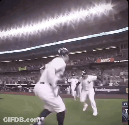 A Baseball Game Is Being Played In A Stadium With An Aws Advertisement GIF
