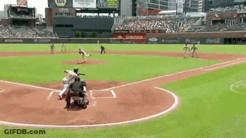 A Baseball Game Is Being Played In A Stadium With Coca Cola And Napa Advertisements On The Stands . GIF