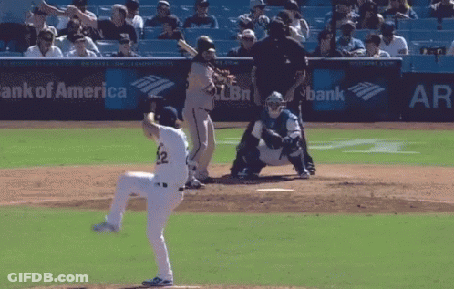 A Baseball Game Is Being Played In Front Of A Bank Of America Sign GIF