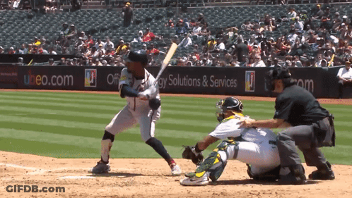A Baseball Game Is Being Played In Front Of A Banner For Energy Solutions & Services GIF