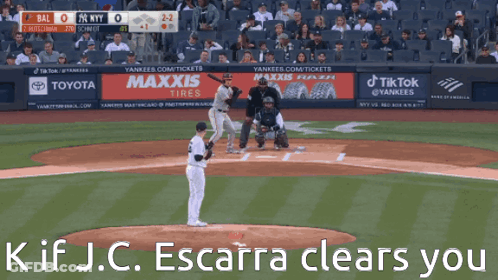 A Baseball Game Is Being Played In Front Of A Banner For Maxxis GIF