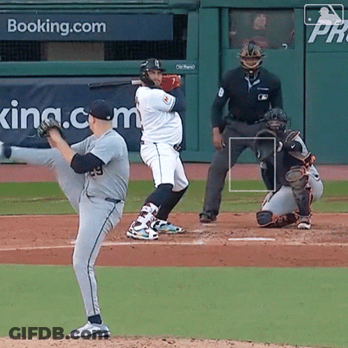 A Baseball Game Is Being Played In Front Of A Banner That Says Booking.com GIF