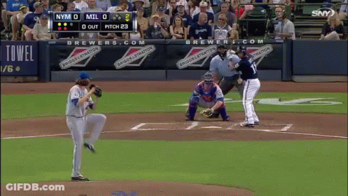 A Baseball Game Is Being Played In Front Of A Banner That Says Brewers GIF