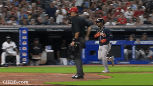 A Baseball Game Is Being Played In Front Of A Banner That Says Chase Bank GIF