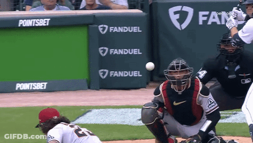 A Baseball Game Is Being Played In Front Of A Banner That Says Fanduel GIF