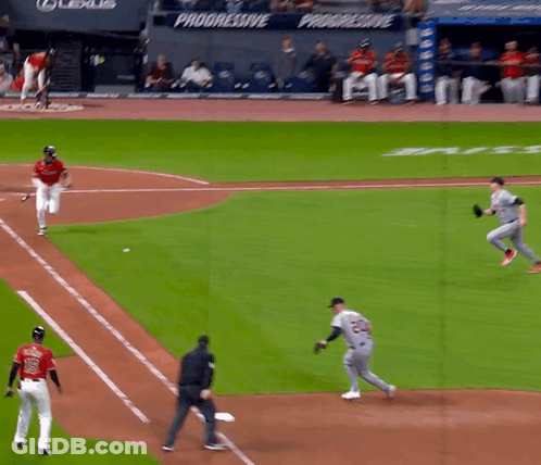 A Baseball Game Is Being Played In Front Of A Banner That Says Progressive GIF