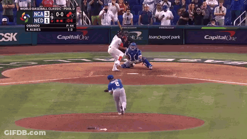 A Baseball Game Is Being Played In Front Of A Capital One Sign GIF
