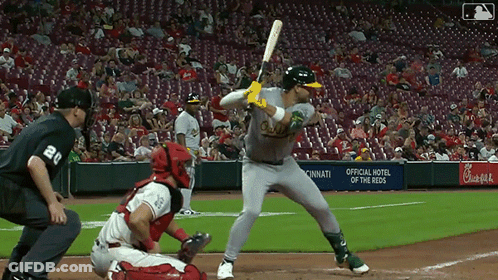 A Baseball Game Is Being Played In Front Of A Chick-Fil-A Banner GIF
