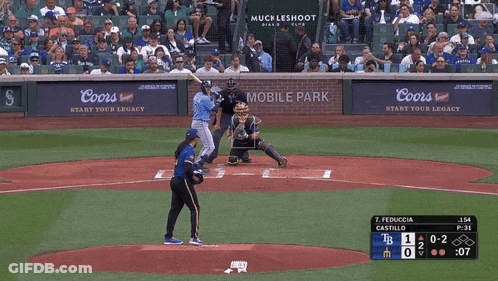 A Baseball Game Is Being Played In Front Of A Coors Sign GIF