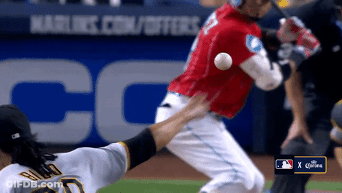 A Baseball Game Is Being Played In Front Of A Corona Banner GIF