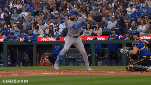 A Baseball Game Is Being Played In Front Of A Crowd With A Fred Meyer Sign In The Outfield GIF