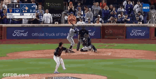 A Baseball Game Is Being Played In Front Of A Crowd With Ford Advertisements GIF