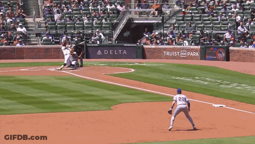 A Baseball Game Is Being Played In Front Of A Delta Ad GIF