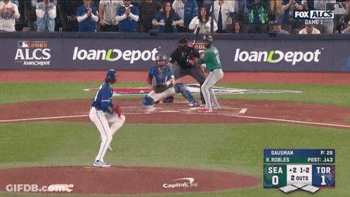 A Baseball Game Is Being Played In Front Of A Fox Alcs Banner GIF