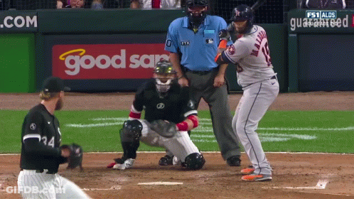 A Baseball Game Is Being Played In Front Of A Good Sam Sign GIF
