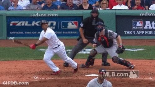 A Baseball Game Is Being Played In Front Of A Mlb.com Advertisement GIF