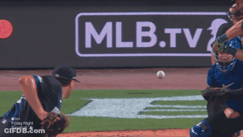 A Baseball Game Is Being Played In Front Of A Mlb.tv Sign GIF
