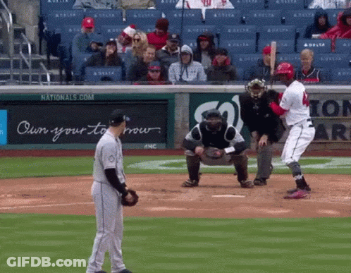 A Baseball Game Is Being Played In Front Of A Nationals.com Sign GIF