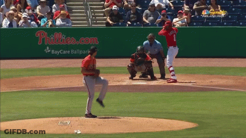 A Baseball Game Is Being Played In Front Of A Phillies.com Sign GIF