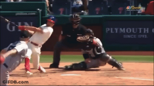 A Baseball Game Is Being Played In Front Of A Plymouth Advertisement GIF