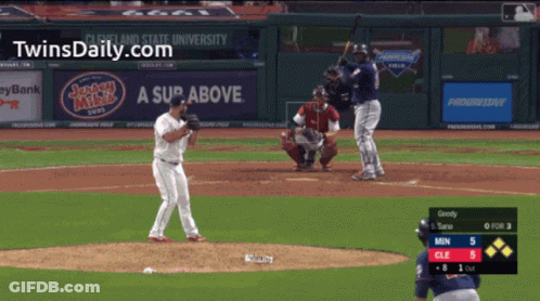 A Baseball Game Is Being Played In Front Of A Sign That Says A Sup Above GIF