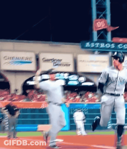 A Baseball Game Is Being Played In Front Of A Sign That Says Astros On It GIF