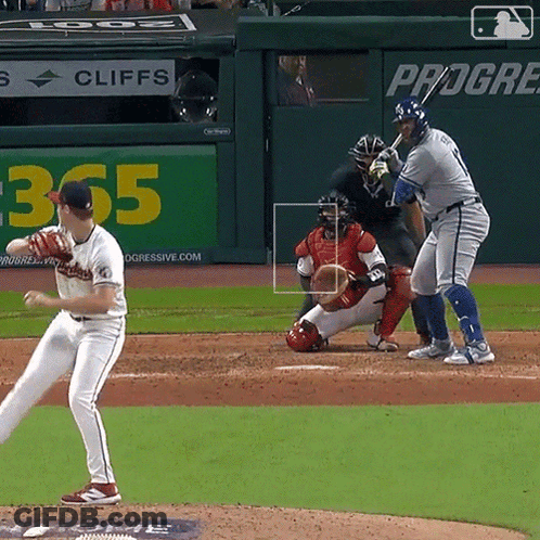 A Baseball Game Is Being Played In Front Of A Sign That Says Cliffs GIF