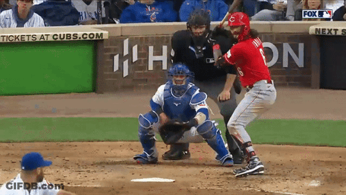 A Baseball Game Is Being Played In Front Of A Sign That Says Cubs.com GIF