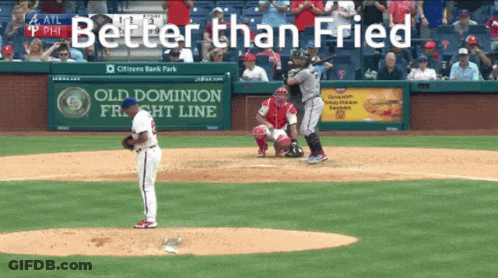 A Baseball Game Is Being Played In Front Of A Sign That Says Old Dominion Freight Line GIF