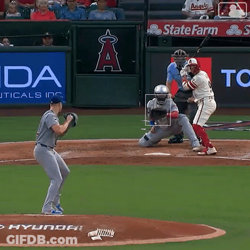 A Baseball Game Is Being Played In Front Of A Sign That Says State Farm GIF