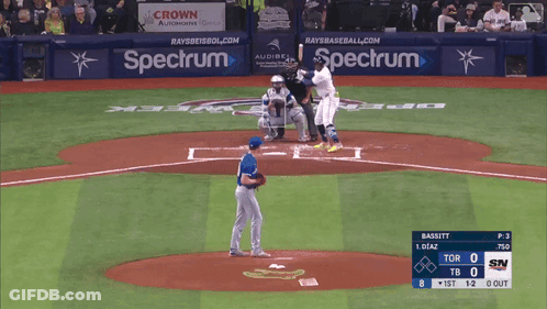 A Baseball Game Is Being Played In Front Of A Spectrum Ad GIF