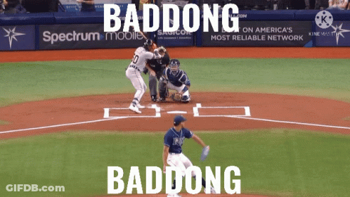 A Baseball Game Is Being Played In Front Of A Spectrum Mobile Sign GIF