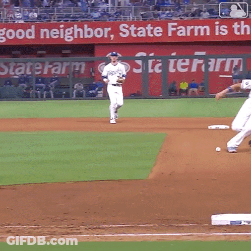 A Baseball Game Is Being Played In Front Of A State Farm Banner GIF