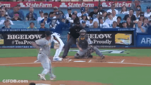 A Baseball Game Is Being Played In Front Of A State Farm Sign GIF