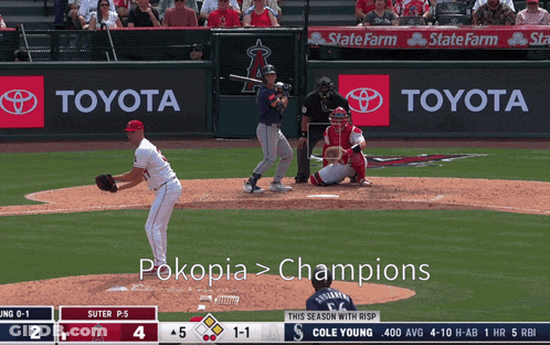 A Baseball Game Is Being Played In Front Of A Toyota Banner GIF