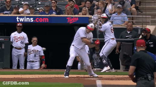 A Baseball Game Is Being Played In Front Of A Twins Advertisement GIF