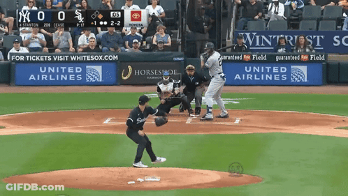 A Baseball Game Is Being Played In Front Of A United Airlines Sign GIF
