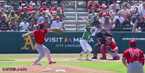 A Baseball Game Is Being Played In Front Of A Visit America Advertisement GIF